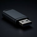 A close-up view of a USB flash drive on a dark surface. The device features a metallic Royalty Free Stock Photo