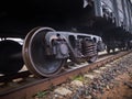 Close up view on used rusted railway freight car bogie with wheel sets with axleboxes, coil springs. Freight train on the railway Royalty Free Stock Photo