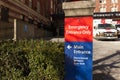 Close up view of Vancouver St. Paul Hospital emergency sign in red with directional arrow Royalty Free Stock Photo