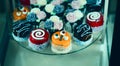 Close up view of various sweet cupcakes, selectively focused, against a bokeh background Royalty Free Stock Photo