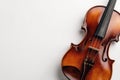 Elegant violin resting against a clean white backdrop Royalty Free Stock Photo