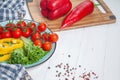 Close up view on vegetables and ingridients ready to cook on white wooden background. Flat lay with empty copy space for text. Royalty Free Stock Photo