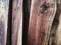 Close-up view of vertical wooden planks showing natural grain and texture, suitable for rustic backgrounds and construction Royalty Free Stock Photo