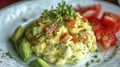 Fluffy Scrambled Eggs with Tomatoes and Avocado Breakfast Dish Royalty Free Stock Photo