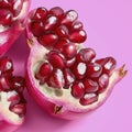 Closeup of Red Pomegranate Arils on Pink Background Royalty Free Stock Photo