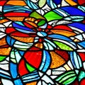 A close-up view of a vibrant stained glass window, casting a mesmerizing play of light and colors2, Generative AI