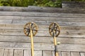 Close up view of vintage bamboo ski poles isolation on wooden background. Royalty Free Stock Photo