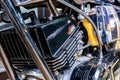 Close-up view of vintage two strokes motorcycle black engine installed on the a metal pipe frame showing the detail of the Royalty Free Stock Photo