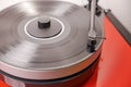 Close-up view of vinyl record player with spinning vinyl record, capturing essence of analog music.