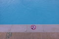 Close up view of warning sign on outdoor swimming pool. Royalty Free Stock Photo