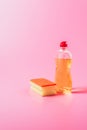 close up view of washing sponge and dishwashing liquid pink Royalty Free Stock Photo