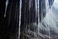 close-up view of water drops falling from cave stalactites Royalty Free Stock Photo