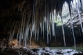 close-up view of water drops falling from cave stalactites Royalty Free Stock Photo
