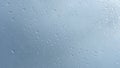 Close up view of water drops falling on glass. Rain running down on window Royalty Free Stock Photo