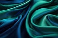 Close-up view of waved blue and green satin fabric