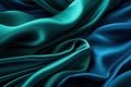 Close-up view of waved blue and green satin fabric