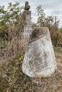 Close up view of weathered tombstone on old abandoned city or village cemetery. Weathered gravestone on abandoned Royalty Free Stock Photo