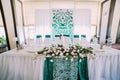 The close-up view of the wedding table set decorated with flowers. Royalty Free Stock Photo
