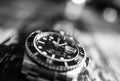 Close-up view of a well-known, Swiss manufactured men`s automatic diving watch seen on a jewellers table. Royalty Free Stock Photo