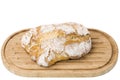 Close up view of wheat yeast bread loaf on wooden cutting board isolated.  Food concept. Royalty Free Stock Photo