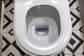 Close up view of white ceramic toilet in modern bathroom. Open toilet bowl Royalty Free Stock Photo