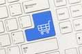 White conceptual keyboard - Shopping cart symbol blue key