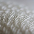 Close-up view of a white fabric surface with a slightly crumpled texture. Threads are Royalty Free Stock Photo