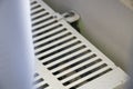 A close-up view of a white heating radiator showcasing its grid pattern and design. Ideal for home improvement, interior Royalty Free Stock Photo