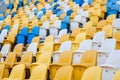 Close-up view of white, red and yellow stadium seats on Olympic stadium.