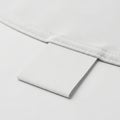 A close-up view of a white, textured, rectangular object with a smooth edge Royalty Free Stock Photo