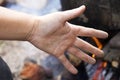 Close-up view of white woman dirty sandy hand palm with spread fingers on blurred colorful sunny outdoors background. Gardening, h