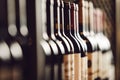 Close-Up View of Wine Bottles Lined Up on Cellar Shelf Highlighting Elite Alcohol Choices Royalty Free Stock Photo