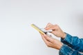 close up view of a woman cleaning mobile phone with disinfectant. Hygiene and coronavirus covid-19 concept Royalty Free Stock Photo