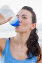 Close up view of woman drinking water after working out Royalty Free Stock Photo