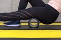 Close up view of woman exercising with foam roller Royalty Free Stock Photo