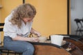 Close-up view of woman hands working on pottery wheel and making clay pot. Hands sculpts a cup from clay pot. Workshop Royalty Free Stock Photo