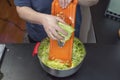 Close up view of woman shredding cabbage. Healthy eating concept