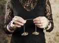 Close up view of woman using traditional Tibetan Tingsha bells or Ting-Sha. Royalty Free Stock Photo