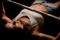 Close-up view of woman who doing intense work out by pushing up barbell in gym. Royalty Free Stock Photo