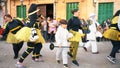 Close-up view of women and children in bee costumes walking and dancing on the street during carnival. Art. Carnival Royalty Free Stock Photo