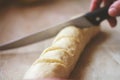 Scoring Bread yeast Dough with knife foe long loaf bread
