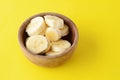 Close up view of wooden bowl with banana slices Royalty Free Stock Photo