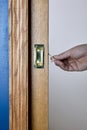 Close up view of a pocket door being opened