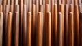 A close-up view of wooden skewers lined up in a row, with the texture of the wood grains clearly visible