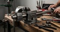 Close-Up View of a Work Bench with a Metal Vice and Assorted Tools for Construction and Repair Royalty Free Stock Photo