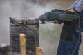 Close up view of working circular saw outdoors, sawdust flying around Royalty Free Stock Photo