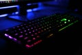 Close up view of workplace with led rainbow backlight gaming key Royalty Free Stock Photo