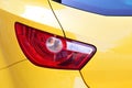 Close-up view of yellow car rear light. Royalty Free Stock Photo