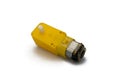 Close-up view of a yellow DC gearbox motor on a white background.