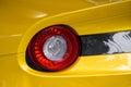 Close-up view of yellow sports car rear light Royalty Free Stock Photo